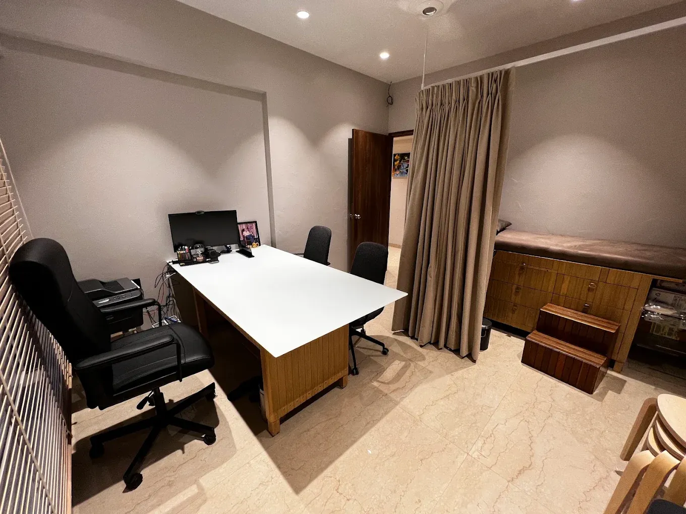 Consultation room with a curtained, private examination area
