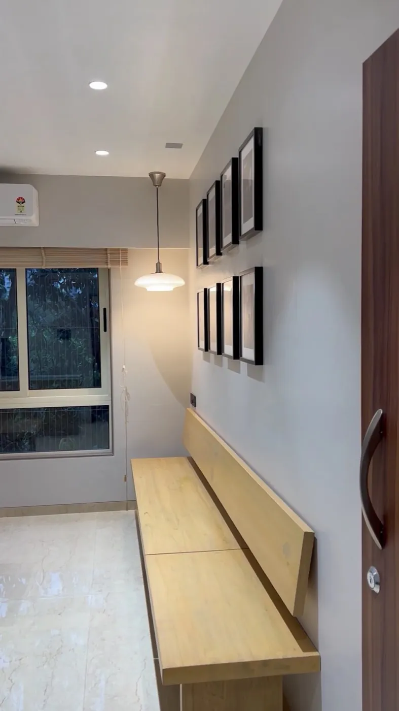 Calm, softly lit waiting corner with wooden bench